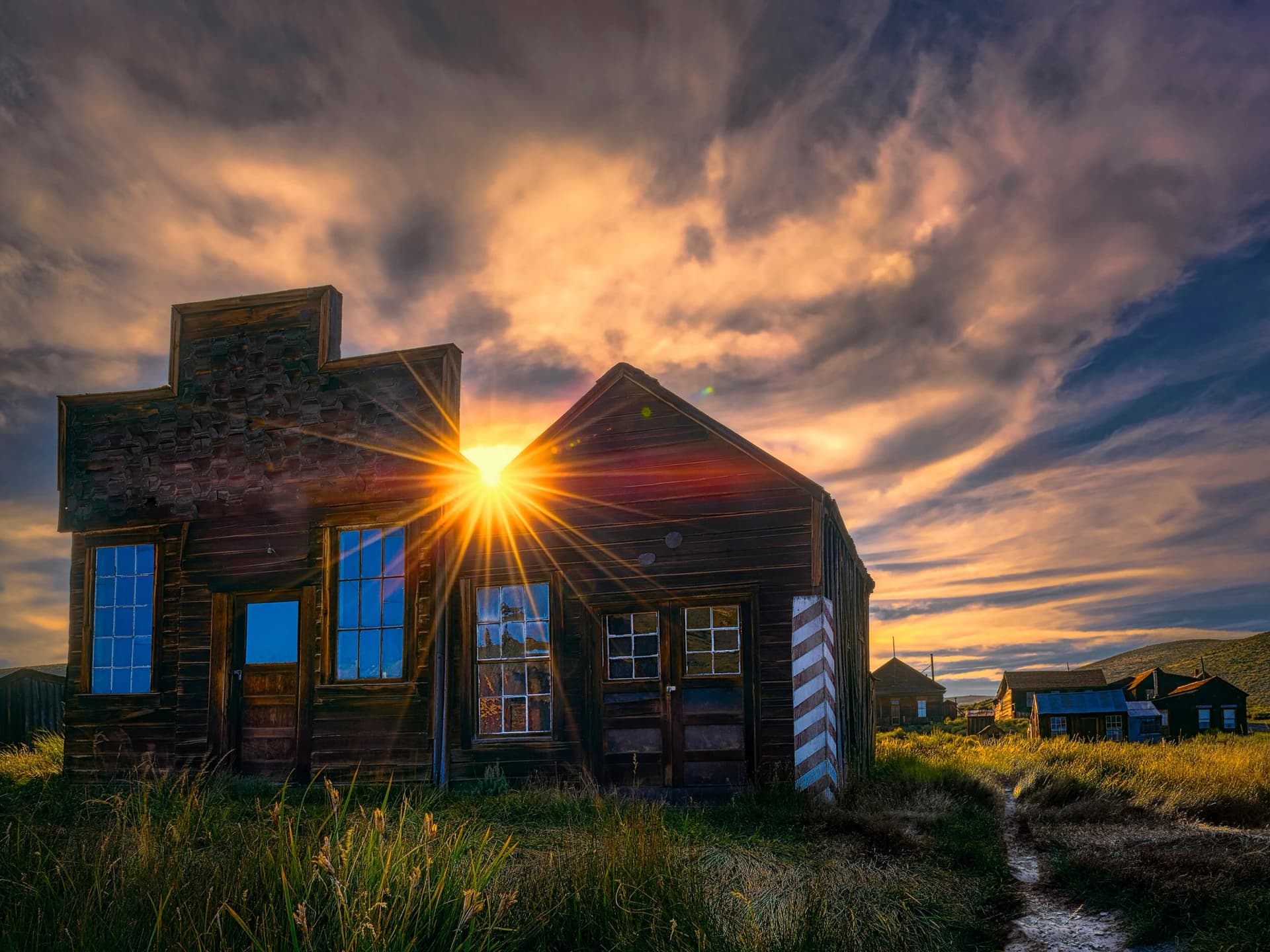 Sunset over the Dean Jeffries Barbershop in the Bodie ghost town, California.